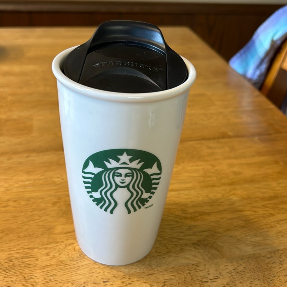 Tall Starbucks travel mug with lid